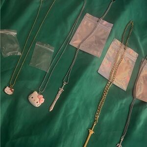 Hello Kitty and Sword Pendant Necklaces, get all 5 necklaces